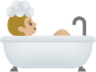 person taking bath: medium-light skin tone emoji