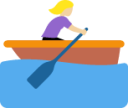 woman rowing boat: medium-light skin tone emoji
