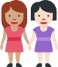 women holding hands: medium skin tone, light skin tone emoji