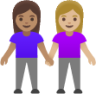 women holding hands: medium skin tone, medium-light skin tone emoji